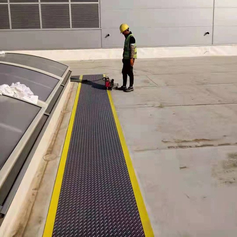 Embossed Synthetic Roofing Underlayment — installation on rooftop